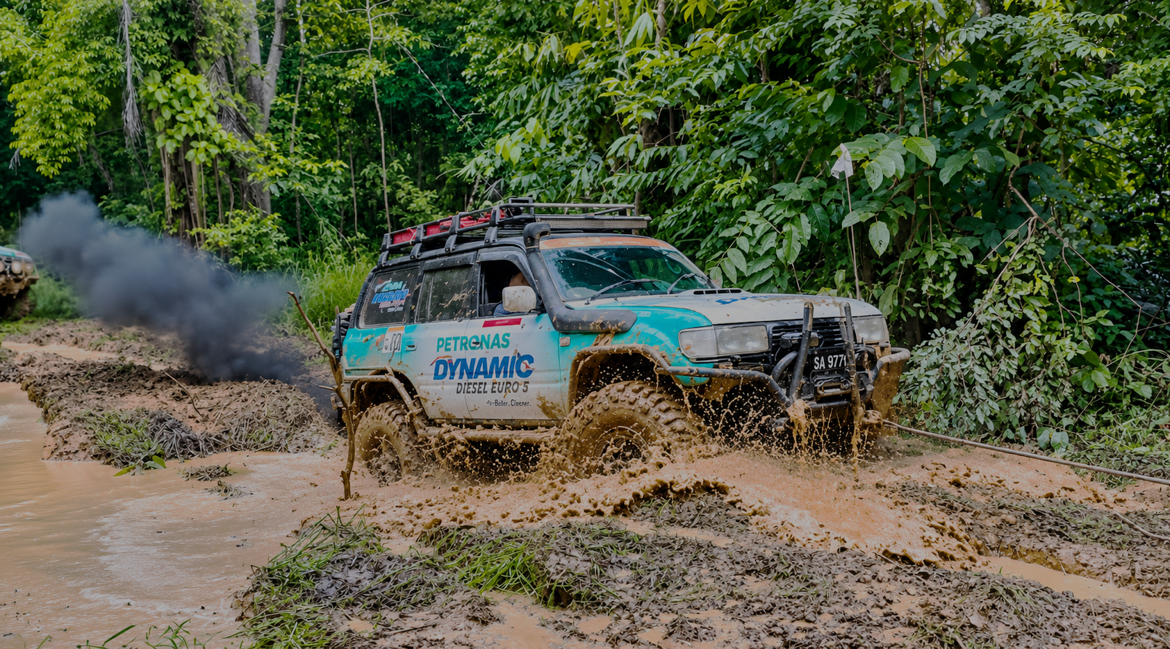 The PETRONAS Dynamic Diesel Euro 5 team 4x4 on a muddy jungle trail at Borneo Safari 2025
