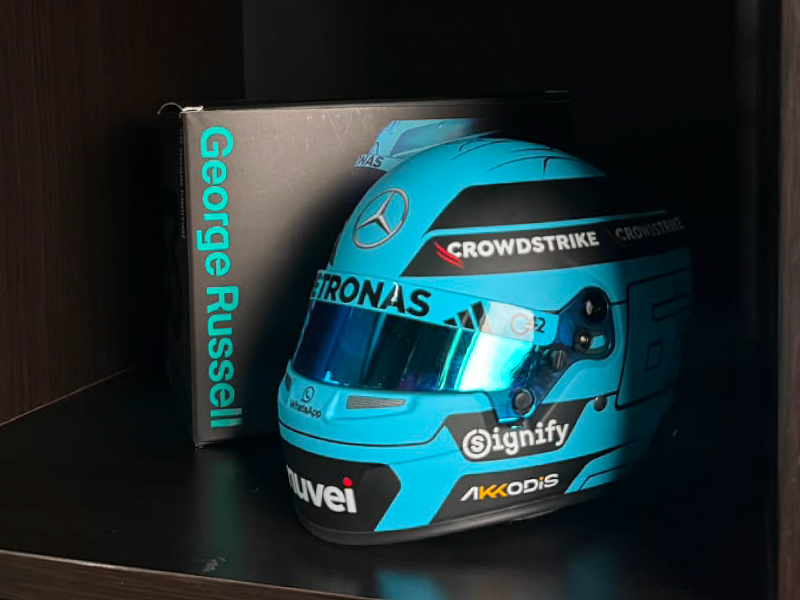 A Mercedes-AMG PETRONAS F1 Team mini helmet signed by the driver