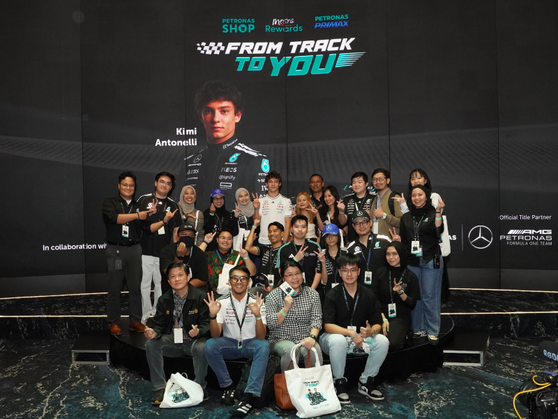 Fans photographed with the Mercedes-AMG PETRONAS F1 Team drivers at a meet and greet